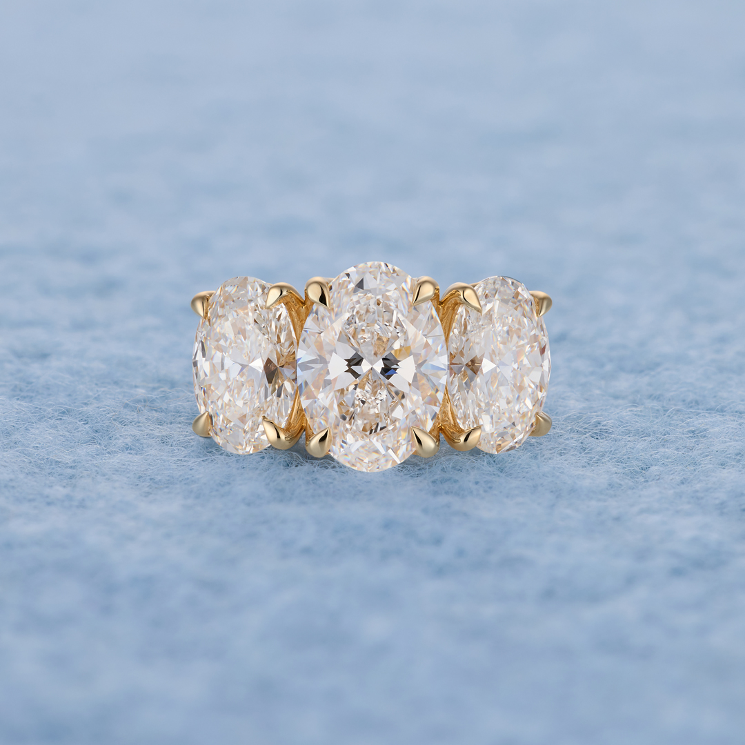 Three-stone oval diamond ring, lifestyle shot