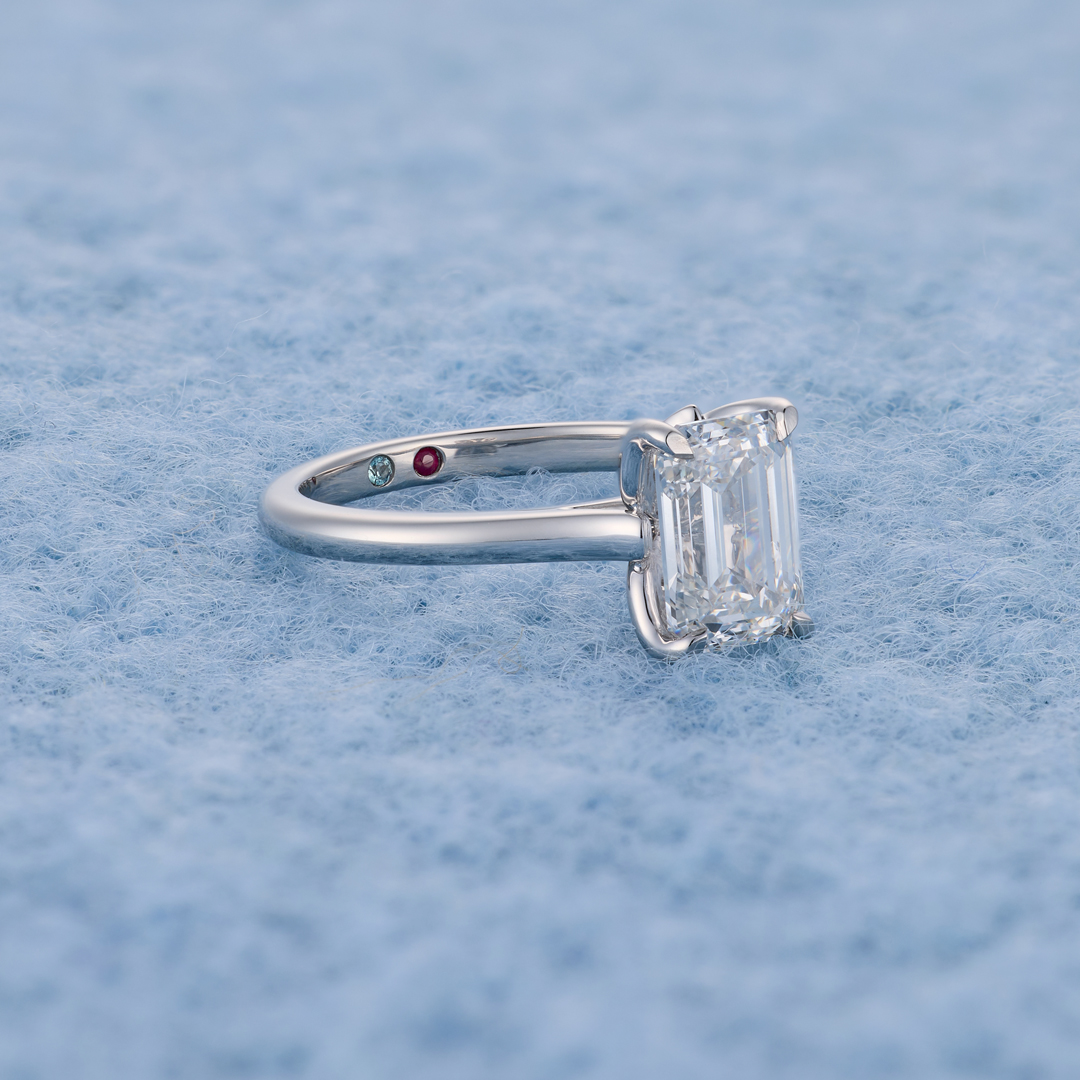 Emerald-cut solitaire, hidden birthstones lifestyle shot